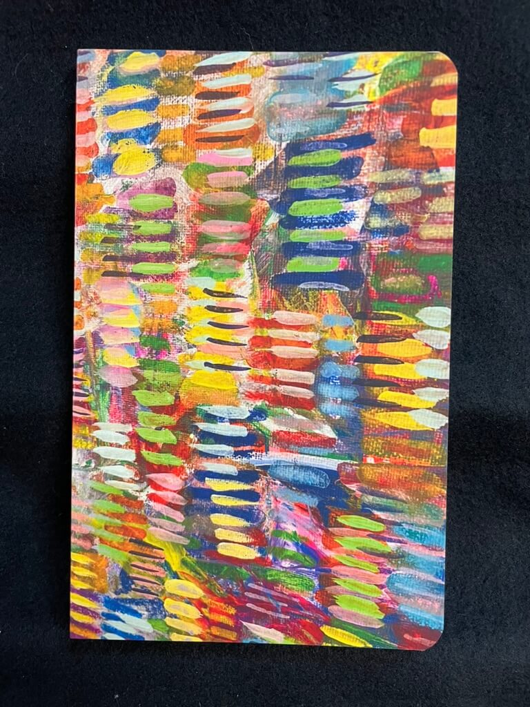 Colorful abstract notebook on a black background