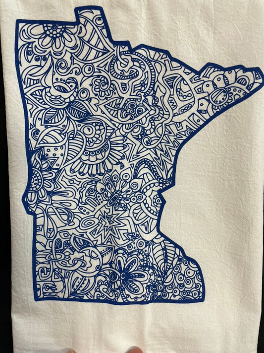 A tea towel with a state shape of Minnesota in blue color, decorated with a floral and geometric pattern.